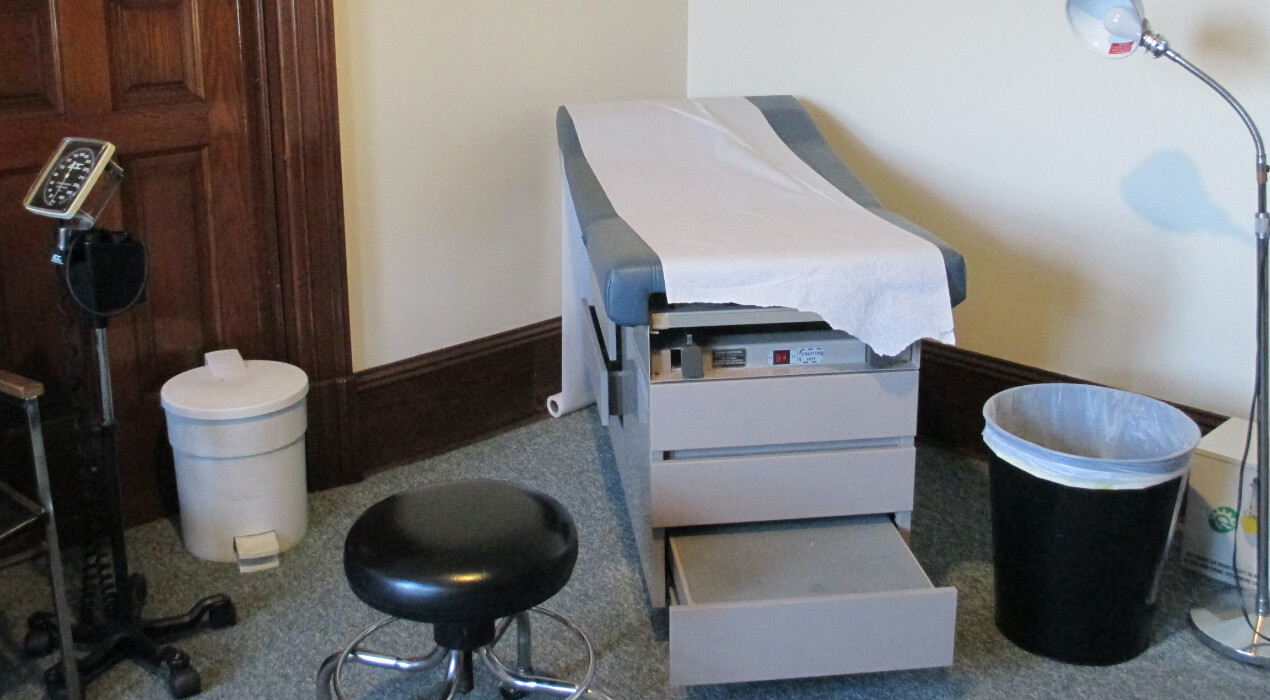 A doctors bed and stool